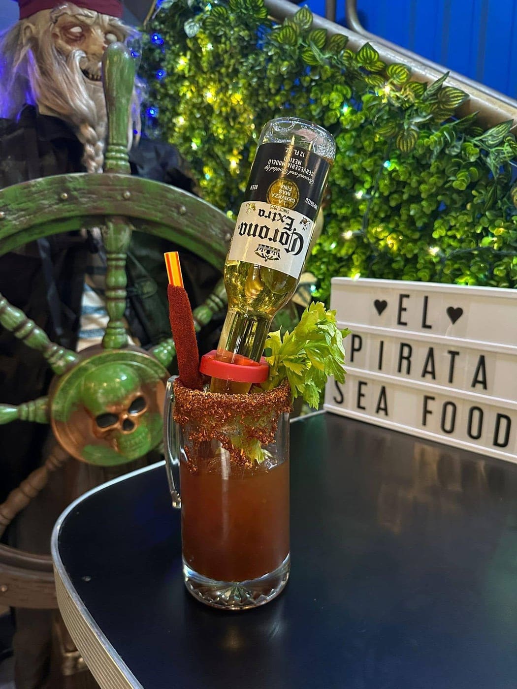 Michelada with Corona at the ship's wheel