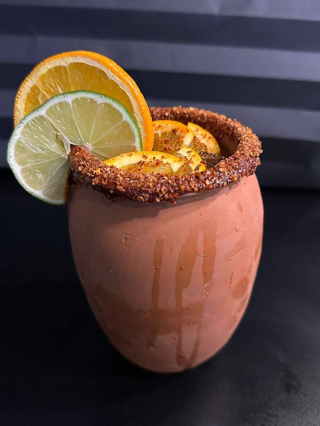 Cantarito in a clay cup, tajín rim