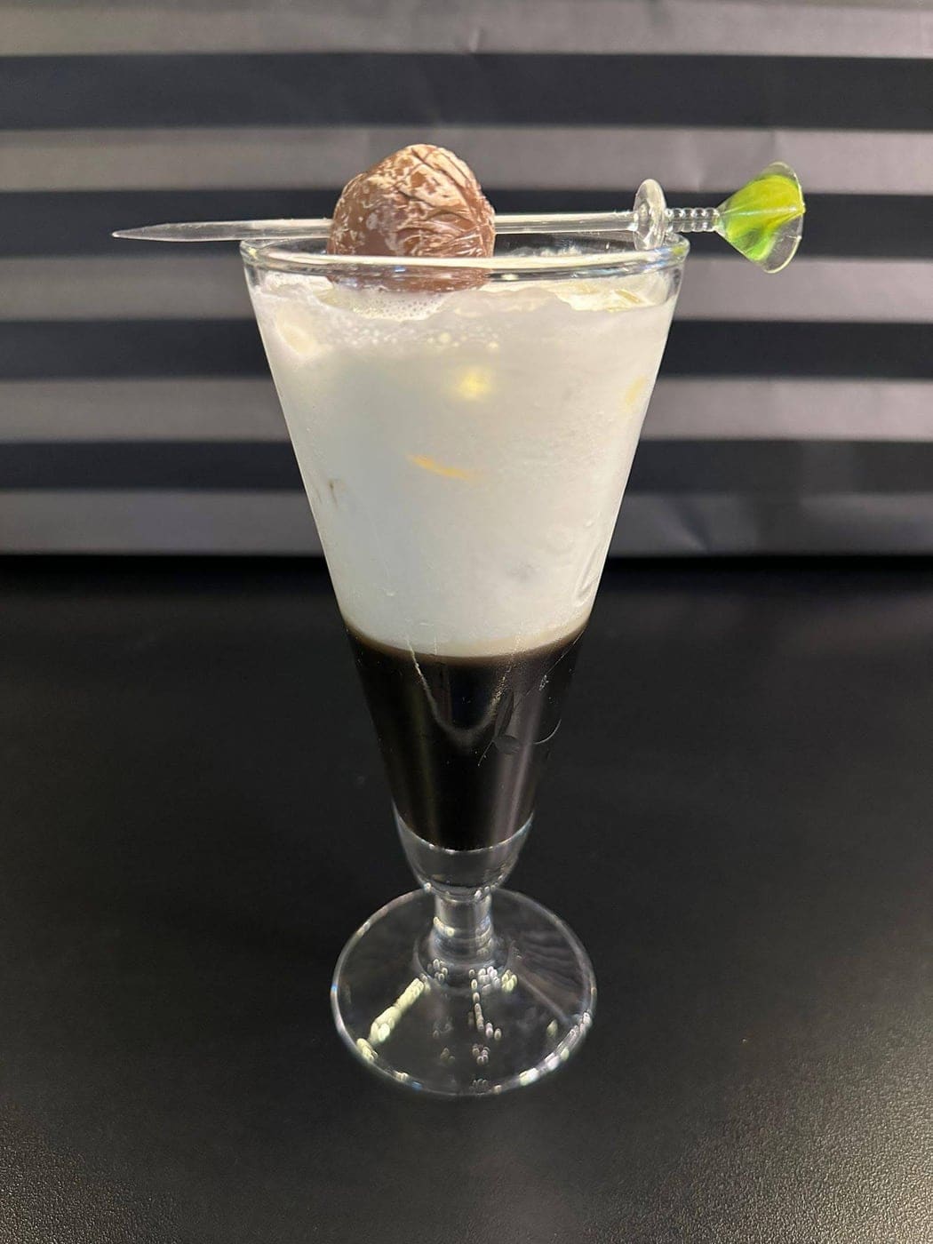 Layered cream-over-coffee shot